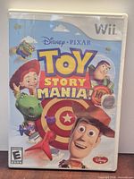 Front view of Toy Story Mania! Wii game case with cover art