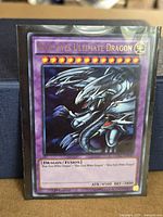 Front of Blue-Eyes Ultimate Dragon card in sleeve
