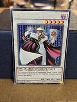 Front view of T.G. Hyper Librarian card showing artwork, Secret Rare foiling, card code LCSD-EN211