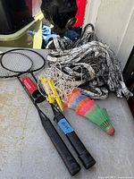 Overall view of rackets, net, shuttlecocks and stakes