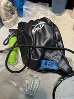 Unbagged Kailun speed bag, hand pump, two carabiners visible