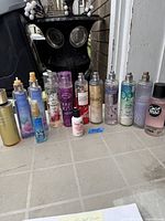 Group shot of all 12 body mists standing in a row
