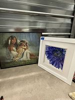 Both framed prints side by side showing relative sizes and frames