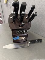 Cuisinart knife block with knives, sharpening steel, Farberware chef knife shown in front