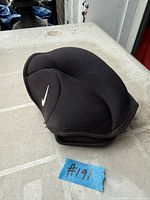 Folded view of black Nike ankle/wrist weight showing swoosh logo