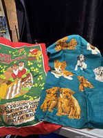 Both tea towels side by side showing designs and colours