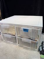 Front view of white plastic 4-drawer unit