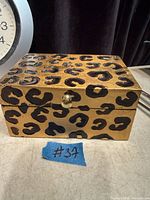 Closed leopard print jewellery box front and top view