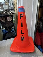 Full view of orange cone front with FILM stencil