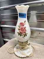 Full view of milk glass table lamp showing floral chimney and hobnail base