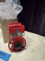 Wire stripper front view beside box