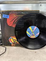 Front album cover and vinyl disc showing Jet Records label