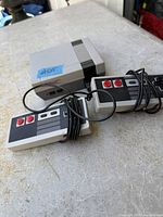 Top view showing NES console and two controllers