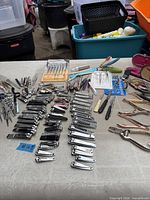 overview showing rows of nail clippers, scissors, tweezers, nail files, manicure tools