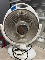 Front view of HomeMAX electric heater showing grille, heating element, base controls and power cord