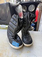 Full view of both boots upright showing upper design and color