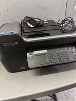 Printer overall view showing Lexmark branding and power cord