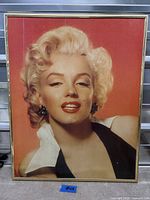 Full view of framed Marilyn Monroe print showing image, frame, and size indicator
