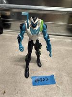 Front view of Max Steel Electro action figure showing size, colors and accessory