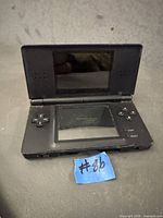 Open black Nintendo DS Lite showing screens and controls