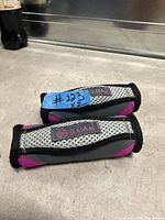 Pair of soft Gaiam wrist/ankle weights showing color, logo and overall condition