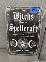 Front view of tin wall art in shrink wrap