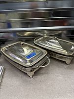 Pair of silver-plated Queen Anne casserole servers with lids, shown closed