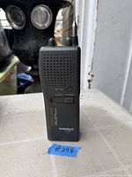 Front view of RadioShack TRC-235 transceiver showing speaker grille, controls, antenna