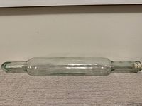 Full view of clear glass rolling pin