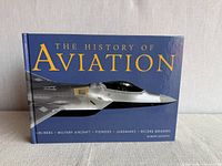 Front cover of hardcover book showing title and jet image
