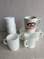 Group of all items: four milk glass handled mugs, three cylindrical milk glass cups stacked, one ceramic A&W mug