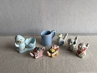 Group shot of all seven ceramic miniatures