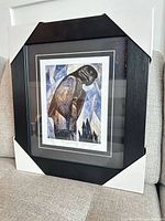 Full framed print with corner protectors on couch