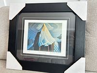 Full view of framed print with corner protectors