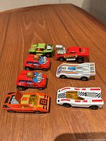 All seven Matchbox cars lined in profile