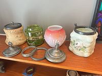 All four cracker jars with lids and rings displayed