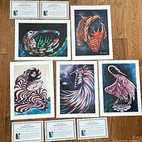 All six prints with certificates laid out on floor