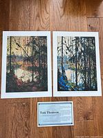 Both unframed prints with certificate card