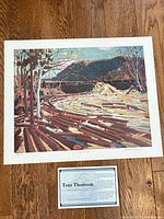 Full view of numbered Tom Thomson print with informational card
