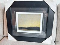 Framed print with corner protectors showing full piece