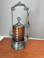 Full view of assembled pickle castor set on wood surface