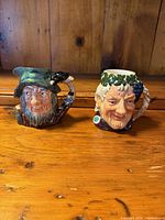 Front view of both Royal Doulton character jugs