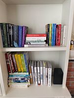 Full view of both shelves showing entire lot of cookbooks