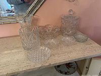 Group shot of all nine crystal pieces on table