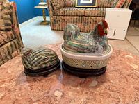Hen tureen and quail box on stands, frontal view