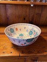 Top view of porcelain bowl showing interior butterfly and lotus design