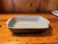 Top view of rectangular casserole showing interior glaze and handles