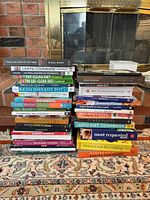 Front view showing two tall stacks of assorted cookbooks