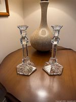 Pair of crystal candlesticks on table