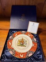 Plate in open presentation box with COA visible